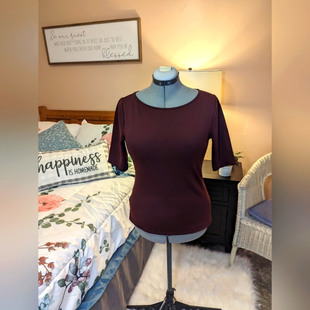 Ann Taylor burgundy  knit top with back zipper and elbow length sleeves